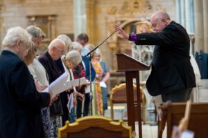 Bishop David in front of some people being commissioned in Truro cathedral