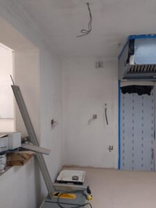 Inside one of the rooms being made with builders equipment