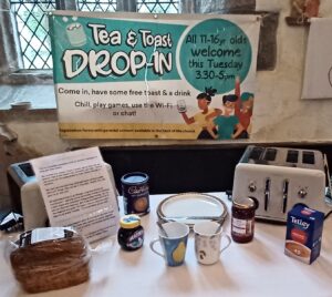 A display advertising tea and toast event. 