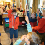 Children in the church pulling ropes.