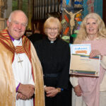 The Bishop of Truro to the left with with two others - one holding a certificate.
