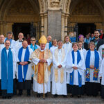 People lined up outside the cathedral for a photograph.