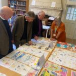 Judges looking at the card designs in Church House.