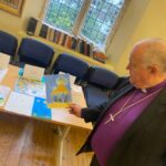 Judges looking at the card designs in Church House.