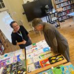 Judges looking at the card designs in Church House.