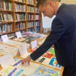 Judges looking at the card designs in Church House.