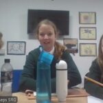 Children looking at the camera - square frames behind them.