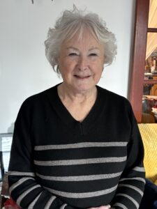 Wendy smiling at the camera.