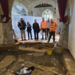 People looking at the excavation.