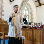 Someone in white in the church.