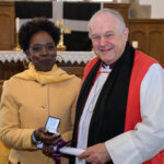 Bishop David with a recipient of the Cross of St Piran.