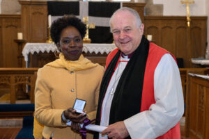 Bishop David with a recipient of the Cross of St Piran.