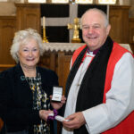 Bishop David with a recipient of the Cross of St Piran.