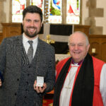 Bishop David with a recipient of the Cross of St Piran.