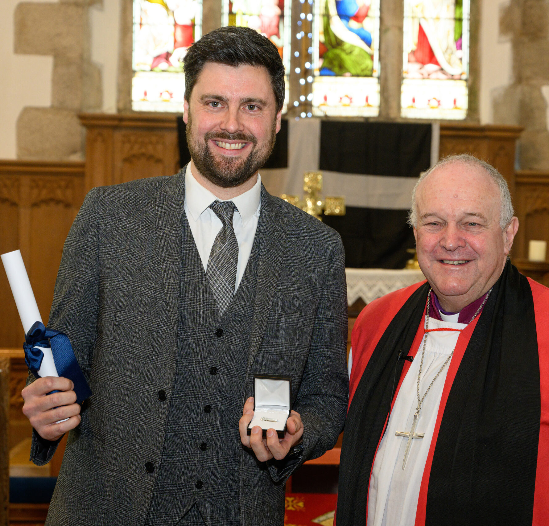 Bishop David with a recipient of the Cross of St Piran.