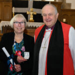 Bishop David with a recipient of the Cross of St Piran.