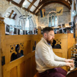 Someone playing music in the church