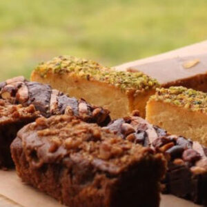 A board with bars of cake on it.