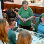 Children watching a workshop demonstration before they give it a go.