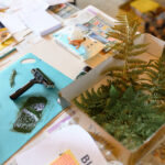 Creative materials and fern for the workshop.