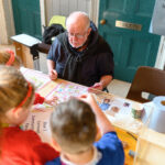 Children watching a workshop demonstration before they give it a go.