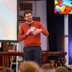 Revd Hugh Barne at the front of the church.
