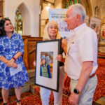 Three people and art in the church